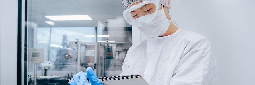 Worker in manufacturing cleanroom