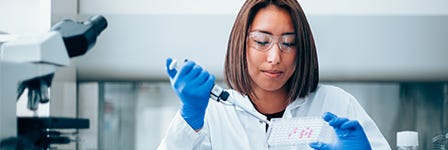 Scientist pipetting in the lab